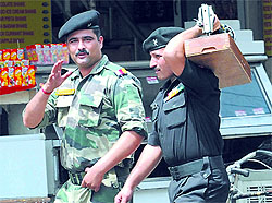 In a departure from the routine, an Armyman carries a sewing machine and not a grenade launcher on his shoulder while carrying out personal chores in Bathinda on Thursday