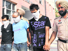 The three accused in police custody at Mohali on Thursday. 