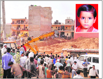 The rescue operation in progress to retrieve four-year-old Maahi (inset) trapped in a borewell at Manesar in Gurgaon district on Thursday.