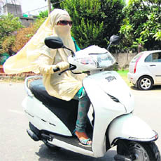 A young two-wheeler rider is all set to face the sun in Amritsar on Friday.