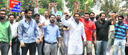 SOPU activists protest at Phase VIII in Mohali on Friday. A Tribune photograph