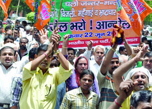 BJP supporters shout anti-UPA slogans in New Delhi on Friday. 