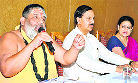 Mahamandaleshwar Swami Achityunanad of the Bhoomanand Charitable Trust along with directors of the Kailash hospital group Dr Mahesh Sharma and Dr Ritu Vohra at a press conference in Haridwar on Friday. 