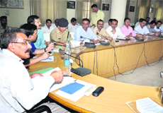 Garhwal Commissioner Kunal Sharma holds a meeting with top police officers of the state and Uttar Pradesh regarding arrangements for the Kanwar mela in Haridwar on Saturday.