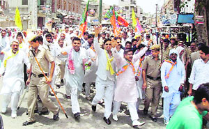 BJP and HJC activists hold a protest march in Sonepat on Friday. 