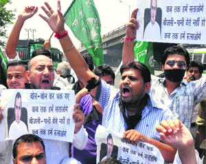PDP activists protest against the shortage of power and water in Jammu on Friday. 