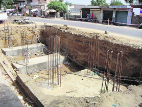 Deep pits dug up by private contractors for erecting a foot over-bridge at Doraha