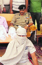 One of the accused in police custody.