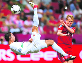 Portugal's Cristiano Ronaldo kicks the ball in front of Czech Republic's Michal Kadlec during their quarterfinal at the National stadium in Warsaw on Thursday. Portugal won 1-0.