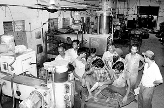 Factory workers while away their time without power at Phase I in Industrial Area, Panchkula, on Saturday.