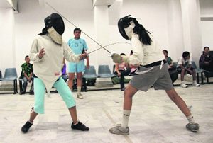Two girls in action at the conclusion of the first fencing camp in Dehradun on Saturday.