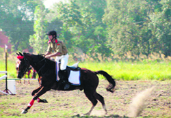 An NCC cadet participates in a horse riding show during an attachment camp with the Indian Military Academy in Dehradun . 