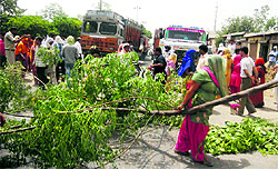 Villagers block NH-10 outside Sankhol village in Jhajjar district on Saturday