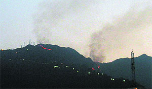 Smoke billows from the Trikuta Hill on the Vaishno Devi yatra route in Katra