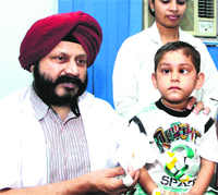 Dr HJ Singh with the patient. 