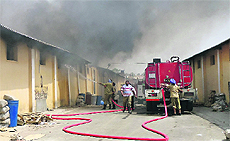 Firemen douse flames at Cremica Sauces in Phillaur on Saturday