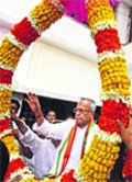 Pranab Mukherjee being garlanded at his ancestral home in Birbhum district on Saturday.  PTI