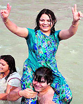 A married couple enjoys a bath in the Ganga in Haridwar on Sunday