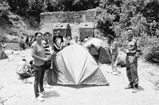 Boys and girls pitch tents during the Northern Command Summer Adventure Camp in a jungle in the Dalhousie hills.