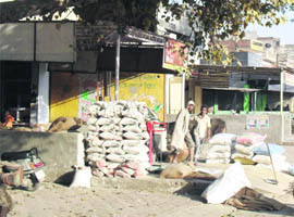 Shopkeepers have encroached on civic body land at the Old Grain Market in Jagraon. 