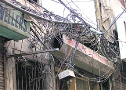 The web of intertwining electric wires hung haphazardly around buildings in the city is an open invitation to a tragedy at Sarafa Bazar in Ludhiana. 
