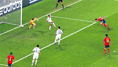 Spain's Xabi Alonso scores a goal past France's goalkeeper Hugo Lloris during their quarterfinal match in Donetsk.