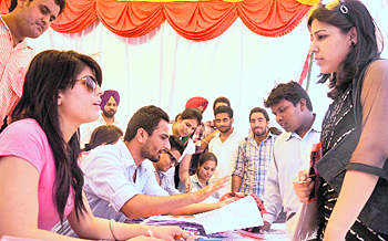 PUSU supporters help students in the admission process at a help desk on Monday.