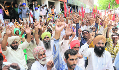 CITU members protest outside the office of Labour Commissioner, Punjab, Sector 17, Chandigarh