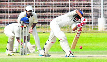 A batsman plays a shot during the match between Chandigarh and Amritsar at the cricket stadium in Sector 16, Chandigarh, on Monday.