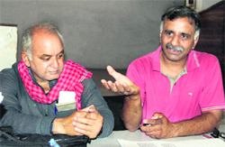 Dr Brijmohan Sharma (right) of SPECS, a voluntary organisation, addresses mediapersons in Dehradun on Monday. 