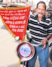 Bathinda-based Rajendra Gupta on his way to the holy Amarnath cave on bicycle in Haridwar on Monday. 