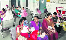 Patients wait for doctors at the Khanna Civil Hospital on Monday.