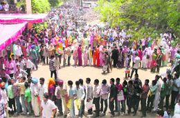 Students stand in a long queue to submit forms at the Punjabi Bhawan in Ludhiana.