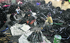 Workers at a cycle manufacturing unit. 