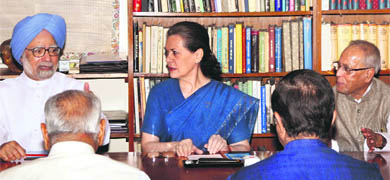 Prime Minister Manmohan Singh, Congress chief Sonia Gandhi and Finance Minister Pranab Mukherjee in New Delhi on Monday. 