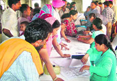 Residents queue up for BPL smart cards. 