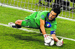 Italys Gianluigi Buffon saves a penalty kick during their quarterfinal match against England in Kiev