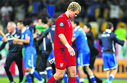Englands goalkeeper Joe Hart reacts after losing to Italy