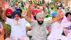 The CTU Workers Union stage a protest for its demands at Phase I, Industrial Area, Chandigarh, on Tuesday