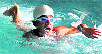 A swimmer in action during the under-14 100m freestyle at the swimming pool in Sector 23 of Chandigarh on Tuesday