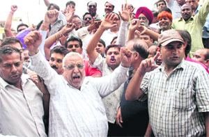 Traders observe a strike in protest against the registration of a case against BJP leader and contractor Umesh Aggarwal in Dehradun on Tuesday.  