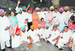 Congress MLAs hold protest outside the Punjab Assembly.