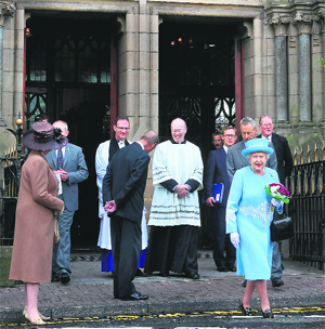 Queen Elizabeth II leaves St Michaels Roman Catholic church in Enniskillen, Northern Ireland, on Tuesday. The Queens visit here will include a historic meeting with deputy first minister Martin McGuinness, a former IRA leader.