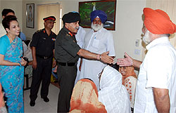 Lt. Gen Sanjiv Anand, GOC Chetak Corps interacts with ex- serviceman during his visit to the ECHS polyclinic in Bathinda Cantonment to review the healthcare facilities there, on Wednesday