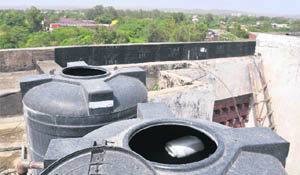 A plastic box floats in a tank on the roof of the Government Multi-Speciality Hospital at Sector 16 in Chandigarh. 
