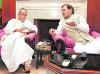 Pranab Mukherjee (L) and JD(U) leader and NDA convener Sharad Yadav in New Delhi. Tribune photo: Mukesh Aggarwal