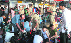 Security personnel check luggage of passengers at the Jammu railway station. Tribune photo: Inderjeet Singh