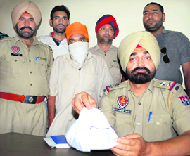 The drug peddler, who was nabbed with 30 gm Ice, in the police net in Jalandhar on Wednesday.