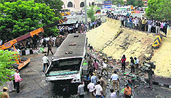 Rescue work in progress after a bus fell off the Anna Bridge in Chennai on Wednesday