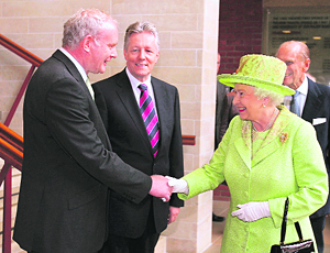 Queen Elizabeth shakes hands with Northern Ireland deputy first minister Martin McGuinness in Belfast on Wednesday